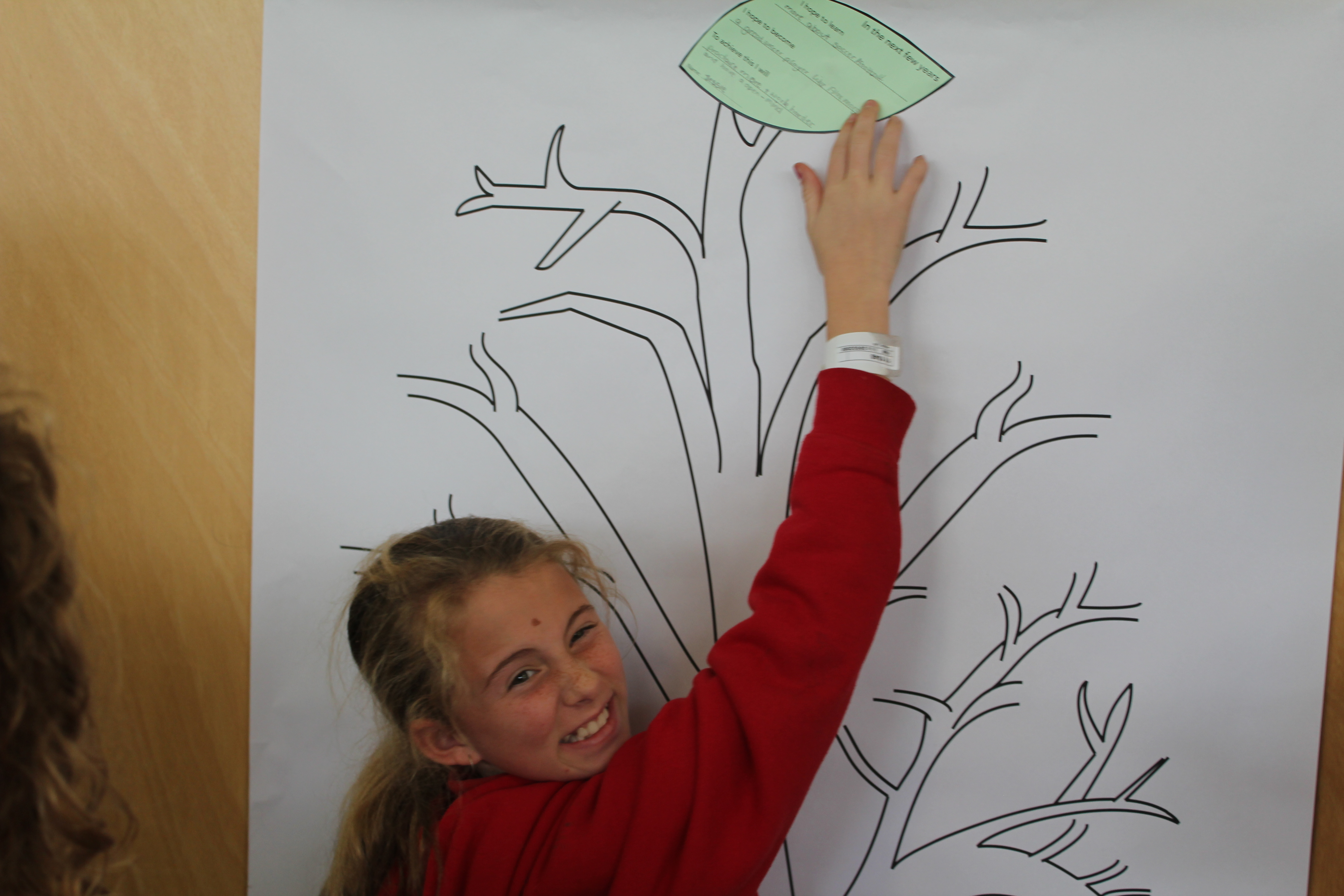 DreamSeeds participant points out her contribution to an activity.
