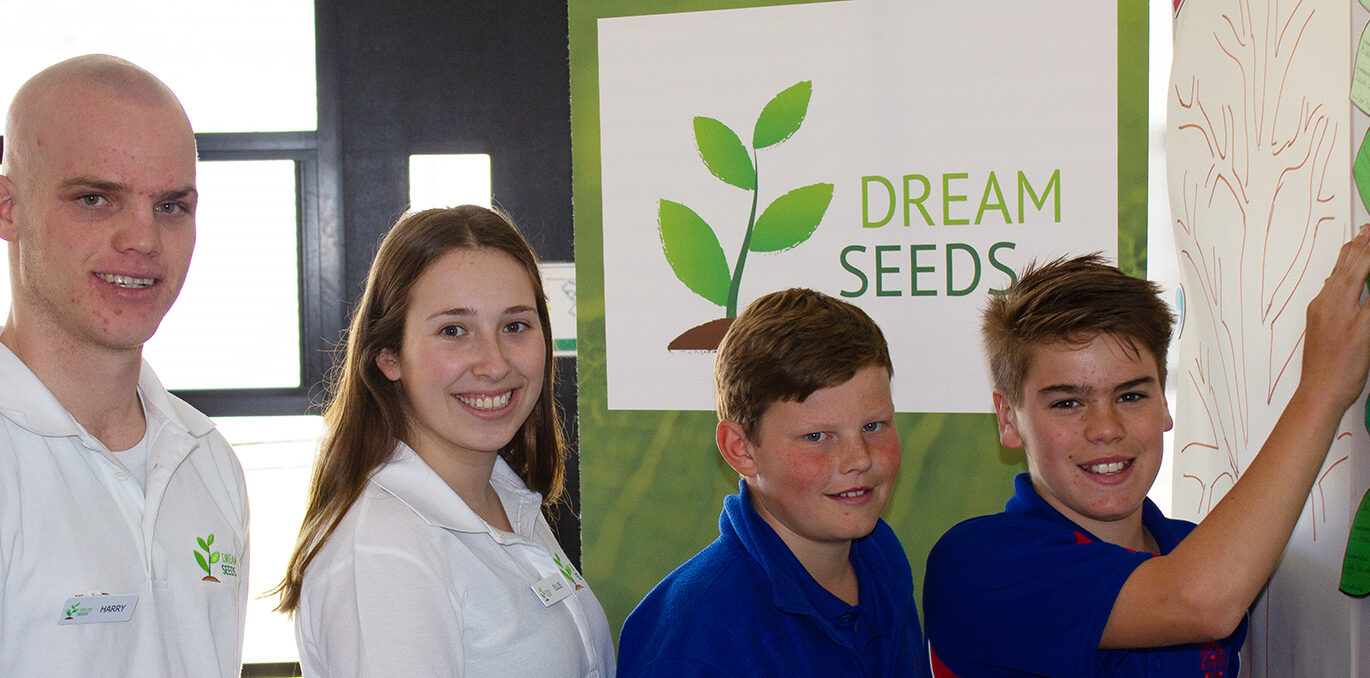 Two Dream Seeds team members and two participants.
